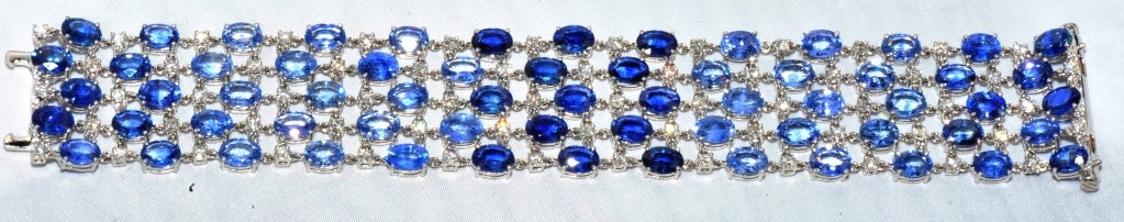 18k White Gold Bracelet with approx. 64.36 carets of Blue Sapphires of Graduated Color and approx.3.09 carats of White Diamonds