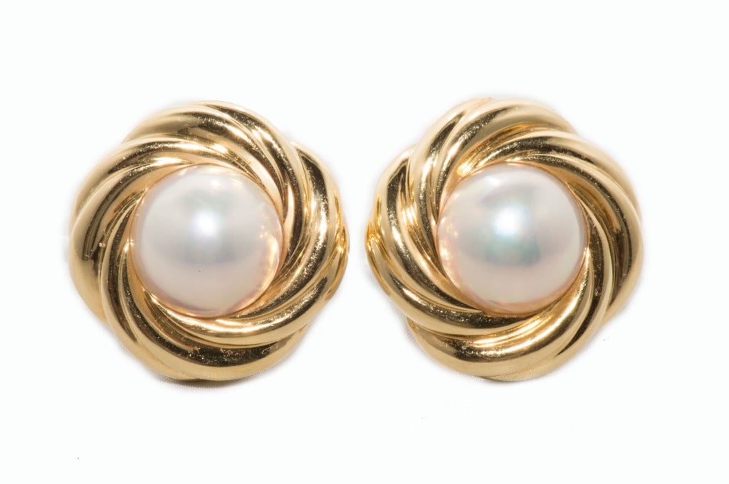 18k Yellow Gold and Mobe Pearl Earrings with
15mm fine quality Mobe pearls. Illegible Hallmark