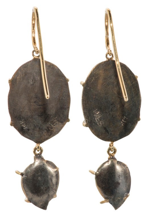Drop earrings made of blue chalcedony and carved moonstone leaves with 14K ear wire.