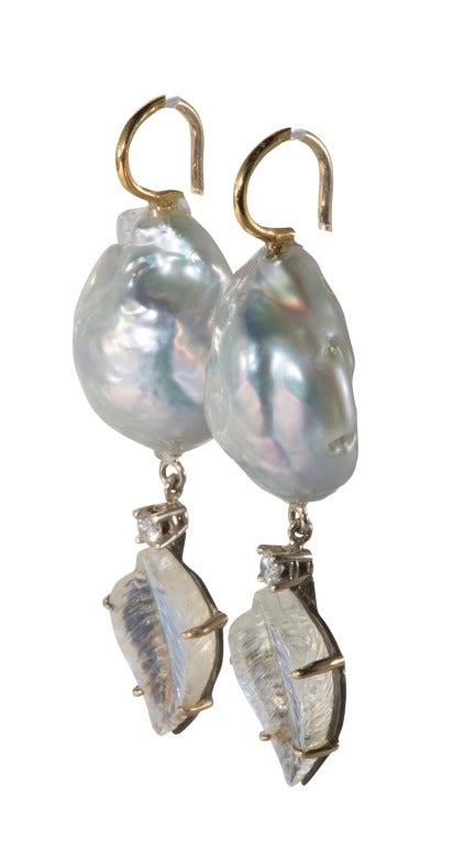 Cultured baroque pearl with diamond and carved moonstone drop.