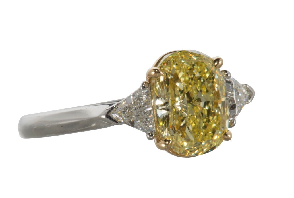 Platinum and 18k Fancy Intense Yellow and White Diamond  Ring. Center FIY 2.78 carats.