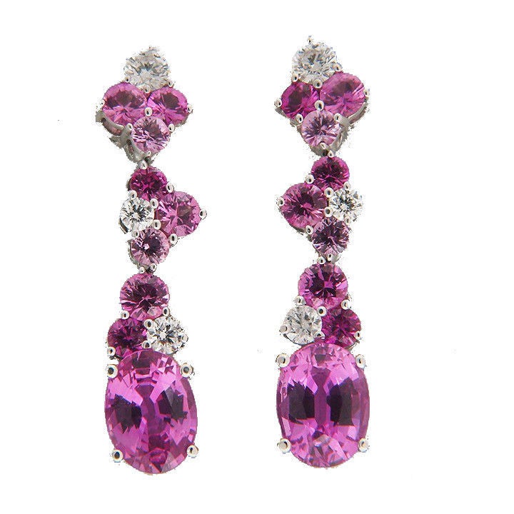 Mark Patterson 18k white gold dangle earrings with all natural no heat pink Sapphires. 

6 full cut diamonds, approx. total weight .30cts, F, VS

2 natural top gem hot pink 8 x 6mm oval Sapphires, approx. total weight 3.10cts

16 round