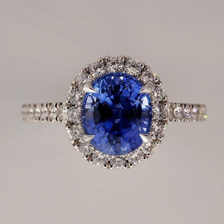 European cut oval Sapphire with extreme brilliance and sparkle. AGL certified simple heat only oval Halo setting from the Peter Suchy Workshop designed for the stone. Super bright medium cornflower blue color, Excellent condition, Looks great on the
