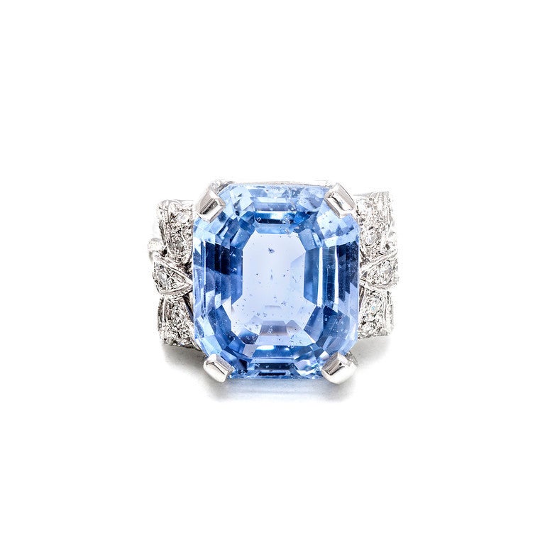 Direct from the 1920s a real show stopper.  15.45ct rectangular original Asscher cut.  The stone is a unique bright light periwinkle blue.  It is crystal clear.  It does have a few flaws that are visible because it is so clear.  The setting is