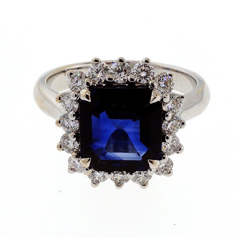Rare and unusual Asscher cut top gem Royal blue Sapphire. Bright inside and out. Custom made 18k white gold ring with diamonds all around the stone. Excellent condition. Looks great on the hand. GIA certified natural corundum simple heat only no
