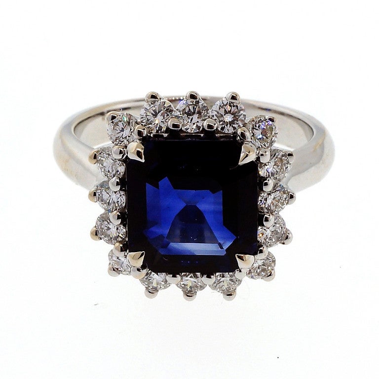 Rare and unusual Asscher cut top gem Royal blue Sapphire. Bright inside and out. Custom made 18k white gold ring with diamonds all around the stone. Excellent condition. Looks great on the hand. GIA certified natural corundum simple heat only no