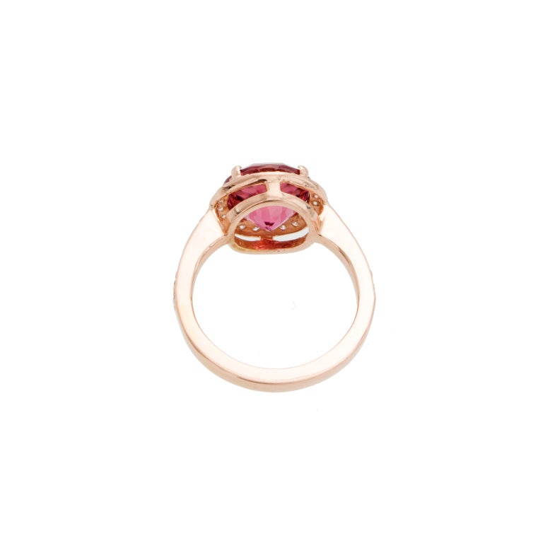 Very special very rare all natural bright pink Tourmaline circa 1900-1920 from an estate. This rare bright pink Tourmaline has been mounted in a simple pink Halo ring from the Peter Suchy Workshop to show off the natural beauty. Excellent condition.