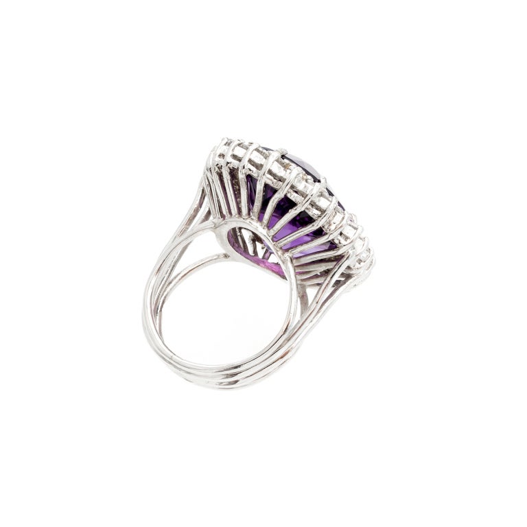 handmade wire ring with a well polished bright purple Amethyst surrounded by a halo of well cut fine white sparkly diamonds. 

1,  22 x 16mm oval fine bright purple Amethyst, approx. total weight 20.00cts, VS1 
30 round full cut diamonds, approx.