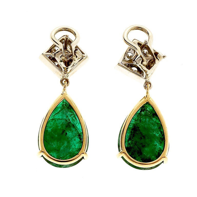 Vintage Estate 15.55ct Rear Emerald Dangle 18k Diamond Dangle Earrings.

Dramatic and important white and yellow gold diamond and Emerald dangle earrings with Pave set diamond tops and rich green Emerald dangles. The Emeralds have good color, with