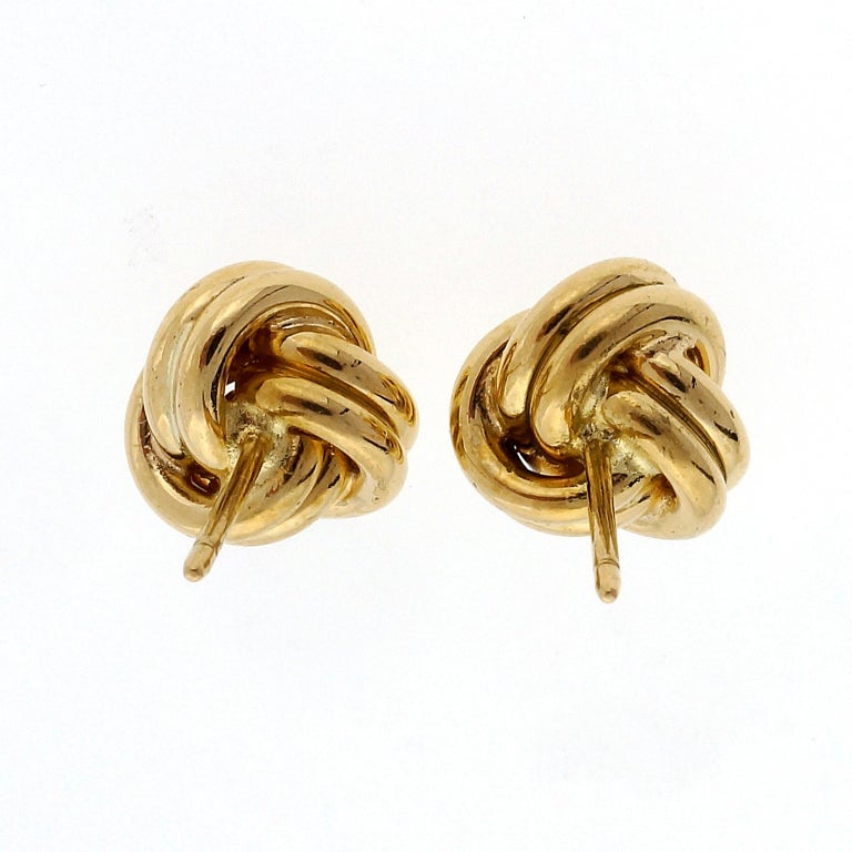 Vintage solid 18k yellow gold twist knot stud earrings. All original stamped posts and original T|+CO friction backs.

7.5 grams
18k Yellow Gold
Stamped: 750
Hallmark: T+CO
Top to bottom: 10mm or .39 inch
Depth: 6.25mm