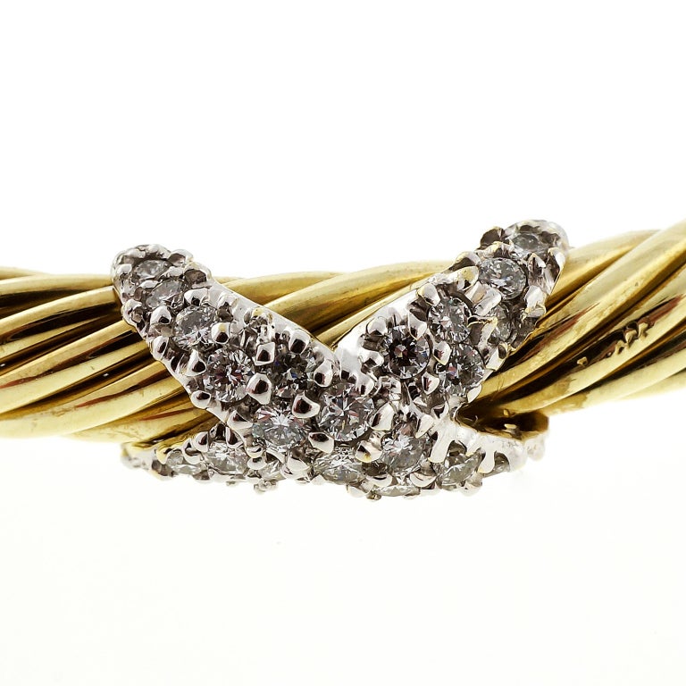 Vintage David Yurman 5mm cable slip on bracelet with 2 diamond X's. Retired style. Excellent condition. Looks great on the wrist.

48 full cut diamonds, approx. total weight .25cts, G-H, VS

16.1 grams
14k Yellow gold
Stamped: 585
Tested: