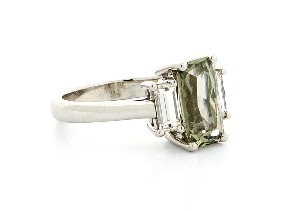 Yellowish green Sapphire, natural color and simple heat only. Unique cut and shape. The stone is from a collector. Brand new handmade Platinum ring from the Peter Suchy workshop designed and made just for this stone.  Excellent condition.  Looks