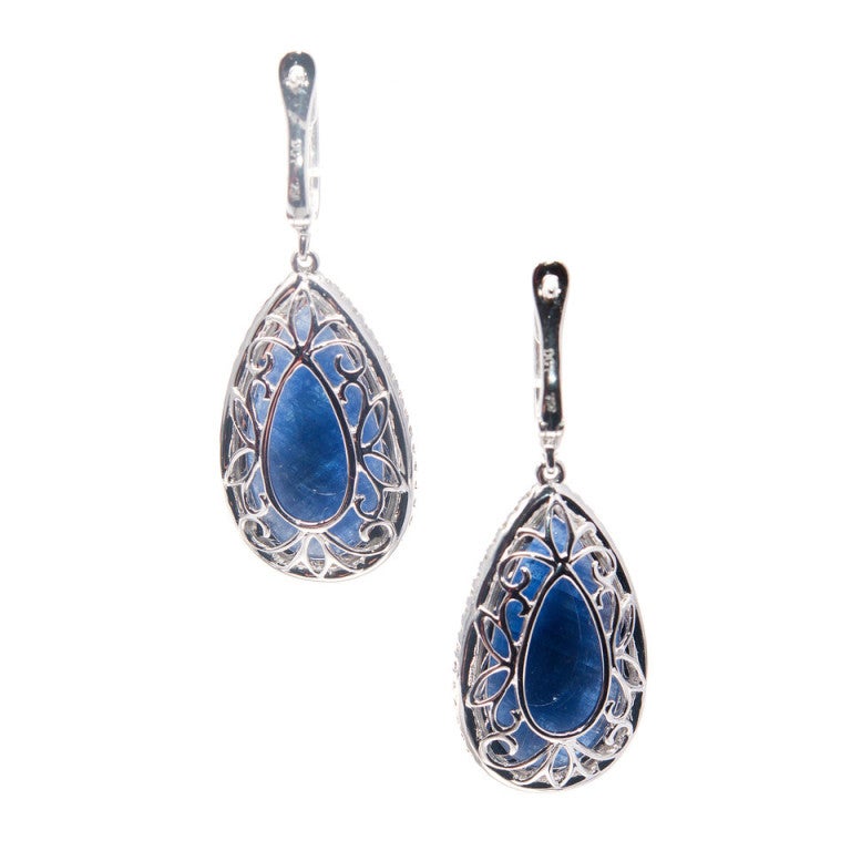 Dilamani simple diamond hoop earrings with fine white full cut diamonds and a one of a kind pair of Sapphires with exceptional Royal blue color and moderate translucency. Guaranteed natural no heat. EX43112SR-204 Dilamani

Top to bottom: 37.79mm