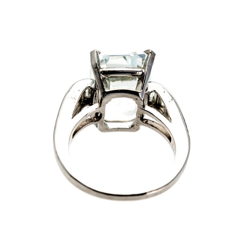All original 1920 to 1930 Art Deco step cut natural sparkly very light blue to white Aqua with diamond like sparkle in original Platinum Art Deco ring. Excellent condition. Looks great on the hand. 

1 Art Deco white to very light blue Emerald