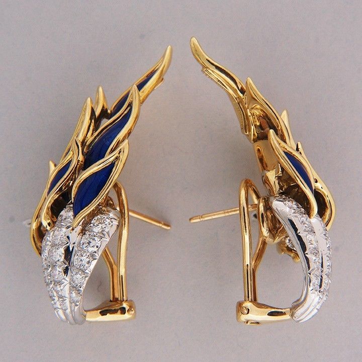 Spectacular all original Tiffany + Co Schlumberger bright blue enamel clip post flame earrings. Circa 1965. Earrings like this seldom come on the market. Excellent condition. Looks great on the ear.     

34 full cut diamonds, approx. total weight
