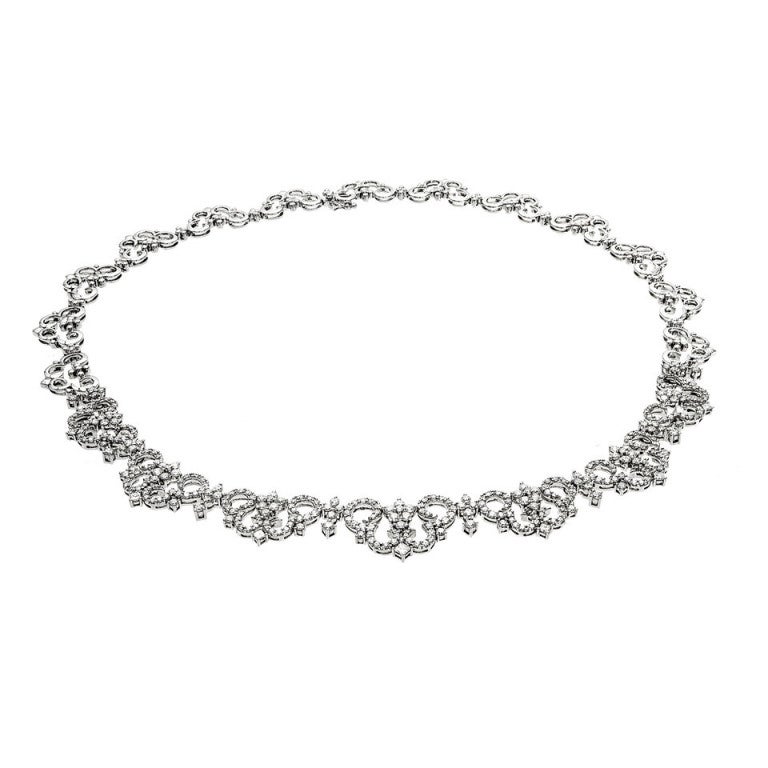 Solid 18k white gold LG designer necklace. New old stock from a jeweler that closed up shop, never worn. 6.37ct of Ideal cut true F, VS diamonds. Looks and feels beautiful and graceful on the neck. Built in hidden catch.

356 brilliant cut
