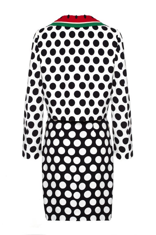 Highly collectable and iconic 1990s polka dot skirt by Moschino Cheap & Chic - an exceptional lightweight crepe skirt with a playful, vibrant fruit theme.  It features white polka dots on black with cherries, orange, lemon and watermelon slice