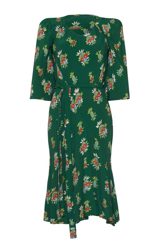 This beautiful early 1970's bias-cut dress by Ossie Clark for Radley comes in a rare moss green colourway of Celia Birtwell's stunning Moroccan print.  The classic 1940's inspired design has mid-length fluted sleeves with a slight puff at the
