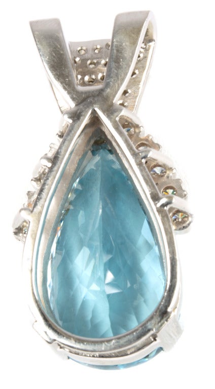 14kt white gold, diamond and aquamarine slider pendant.  The center aquamarine weighs approximately 42.0 carats.  The slider is set with twenty-eight prong-set round brilliant-cut diamonds with average weights of .03 carats and quality of SI1