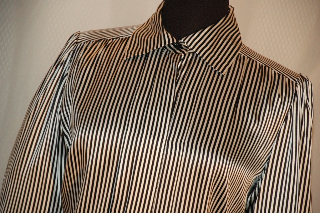 This is a gorgeous vintage 1984 Yves Saint Laurent Rive Gauche black and white stripe 100% silk blouse with hidden buttons. Made in France.  Size 38
Measurements:
Bust 40