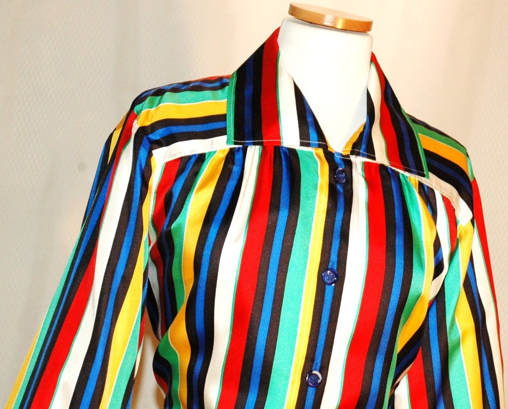 This is a gorgeous vintage 1985 Yves Saint Laurent Rive Gauche 100% silk blouse with vibriant stripes button up.  Made in France.  Size 38
Measurements:
Bust 40