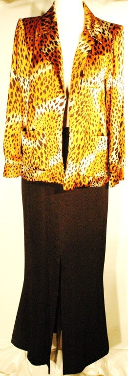 This is a vintage amazing Yves Saint Laurent  Rive Gauche Leopard print 100% silk jacket cover top with pockets and cuffed long sleeves.  Made in France. Fully lined. Size 36 Shoulder pads.
Measurements:
Length  28