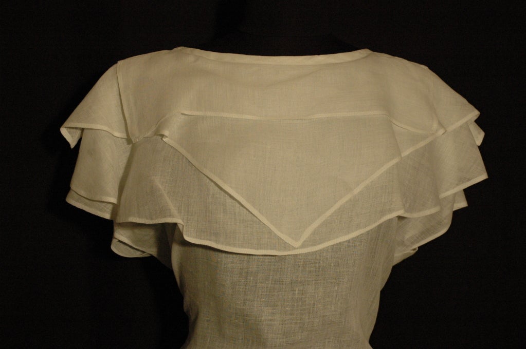 This is a vintage 1970s Genny by Gianni Versace white 100% linen 3 layered top.

Measures 25