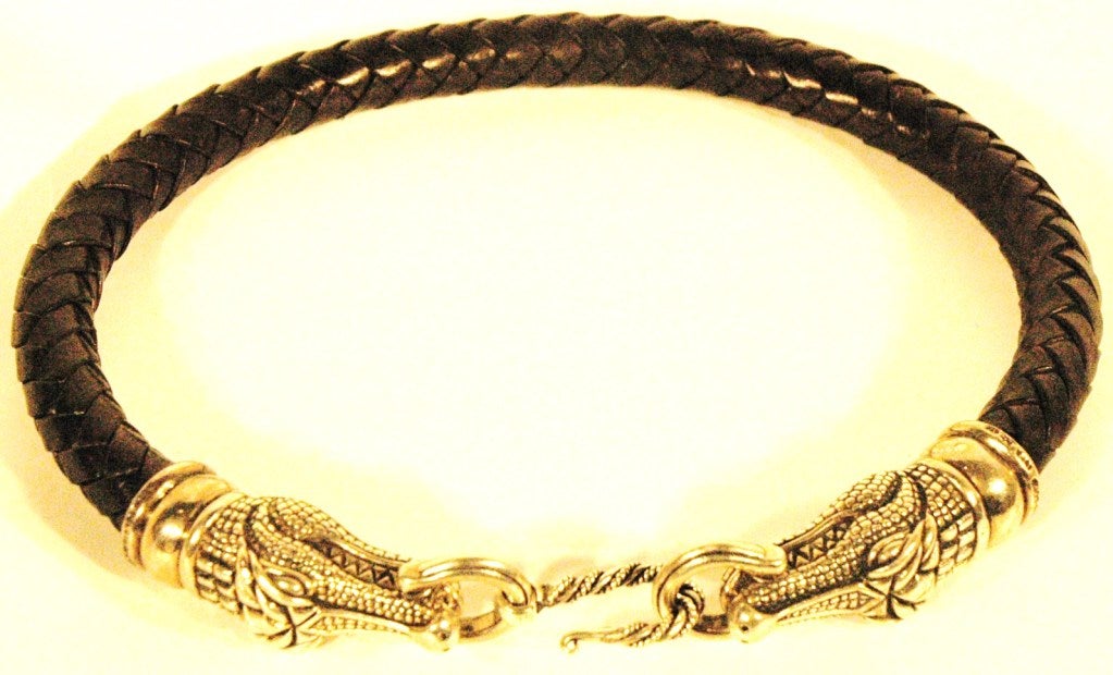 This is a 1993 Barry Kieselstein-Cord double alligator head sterling silver 925 with black leather choker necklace.  Hooks in the front from one gator to the other.  Measures 17