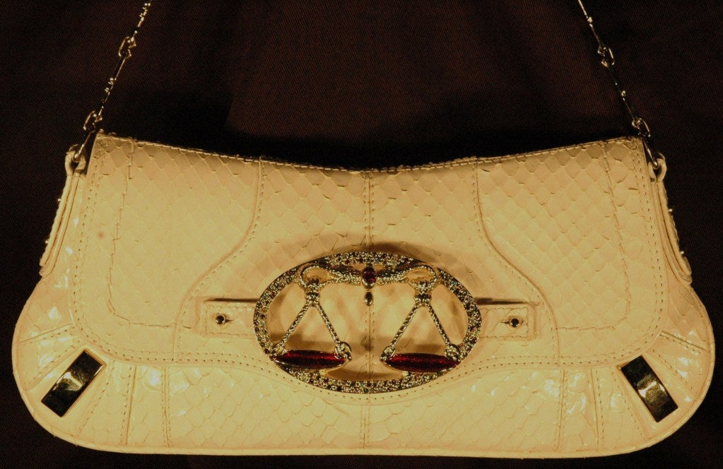 This is a Dolce & Gabbana Zodiac Libra Collection Limited Runway python snakeskin evening handbag with Libra metal swarovski crystal detail. Made in Italy.  D&G metal chains.
Approximate Measure:
12 x 6 x 2