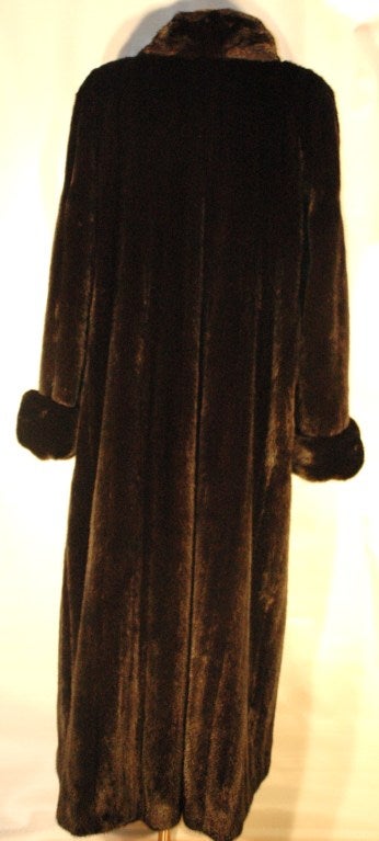 This is a gorgeous Maximilian Alta Moda long full length black mink fur coat from Bloomingdales. Two side pockets, one button and snap closures.
 Size 14
Cold a/c storage, perfect condition.
Measurements:
Overall length 54