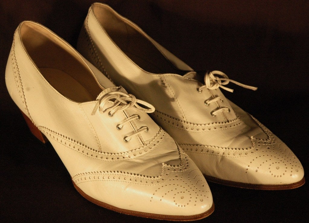 These are gorgeous Hermes ivory leather lace up spectator with low 1 3/4