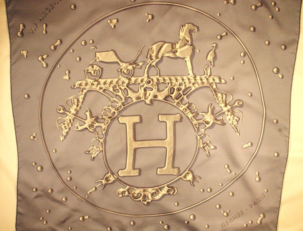 This is a beautiful Hermes Paris hand rolled silk scarf VIF Argent by
Dimitri Rybaltchenko tucked nicely in the box.
Made in France
35 x 35