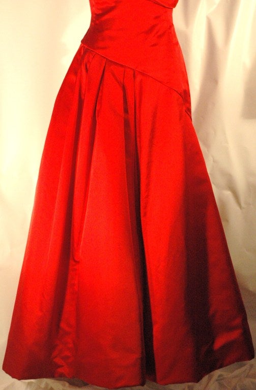 This is a vintage gorgeous red Arnold Scaasi Boutique long evening gown for Elizabeth Arden The Salon.
silk full skirt with lining, a layer of tulle, and silk
Measurements
sleeves 7