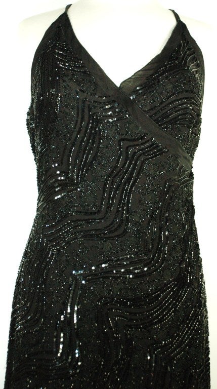 This is a beautiful must have Giorgio Armani black long beaded evening gown with criss cross back straps and front chris cross with high hip draping.  Back zipper.  SIlk chiffion covered in beads. Black lable Armani
Measurements:
bust up to