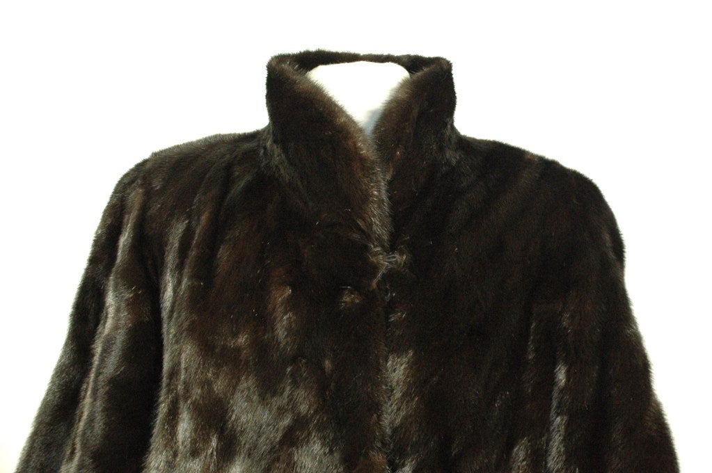 This is a gorgeous Michael Forrest black mink coat in perfect condition.  Two front pockets. 
Measurements:
sleeves  22