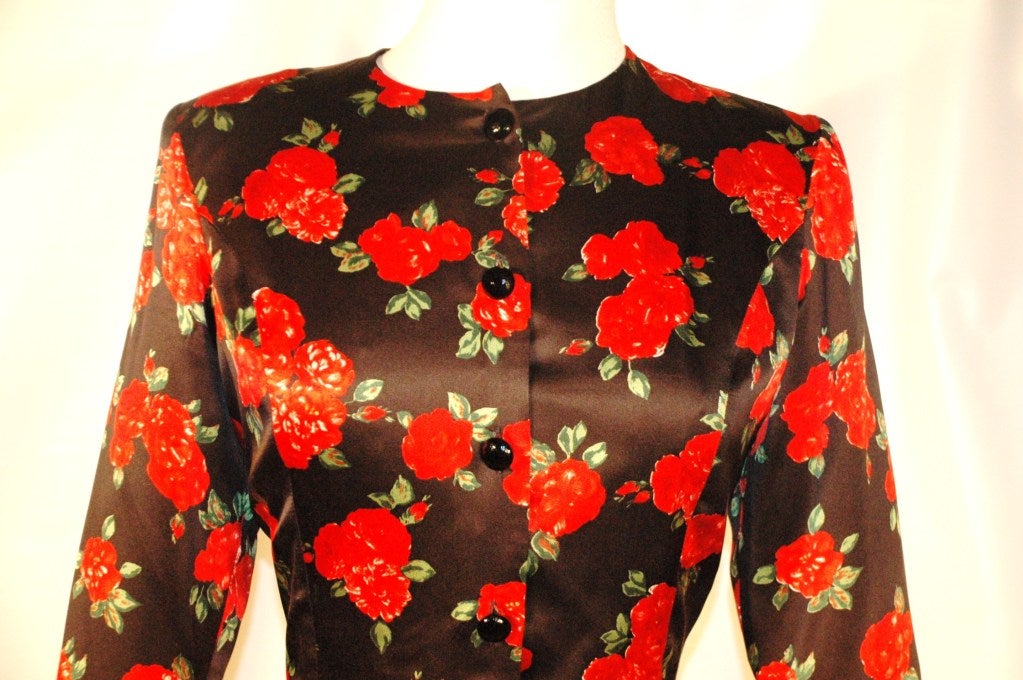 This is an incredible vintage Yves Saint Laurent Rive Gauche 100% silk 4 button up long sleeve black with red flowers throughout top.  Fully lined in silk.  Model/Style on tag reads 01D 33 527.  Made in France Day to evening depending on how you