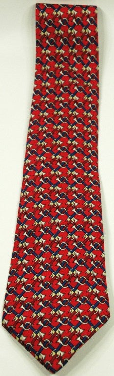 This is an Hermes 100% silk trumpet horns all over. Red, navy, white 7039 TA
Made in France