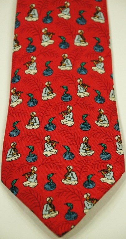 This is an Hermes cobra snakes and charmers print pattern 100% silk tie 
7485 IA
Made in France