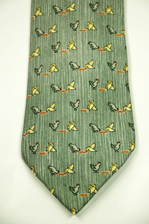 This is an Hermes Chickens & Paper Crane  Origami 100% silk tie with gray, blue, white.
Made in France
Perfect condition!