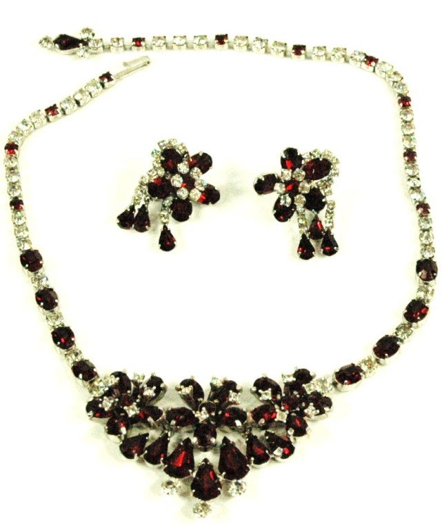 This is a vintage Christian Dior By Kramer red and clear stones crystals cluster necklace and clip on earring set with silver tone hardware.
Necklace measures adjustible total length 17