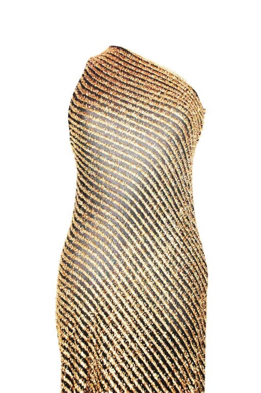 This is a vintage Stephen Burrows sex one shoulder sheer black and gold  evening dress. In perfect condition. High slit up the leg.
Measurements:
Up to 34 bust
up to 30 waist
