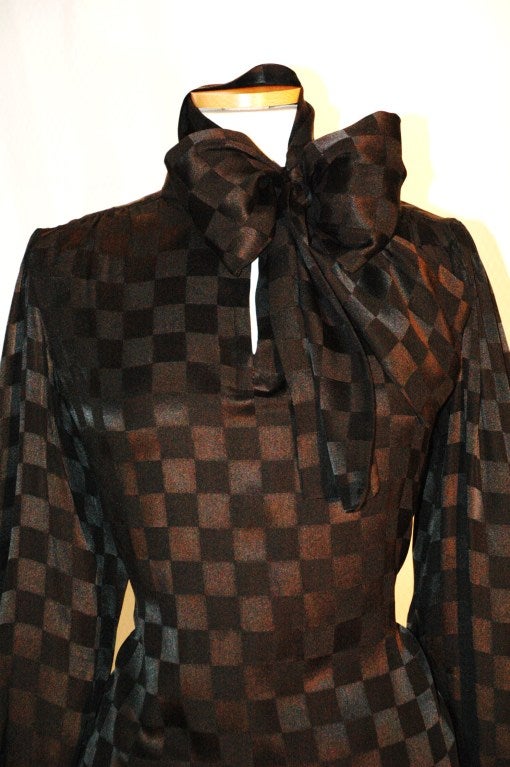 Vintage Yves Saint Laurent Rive Gauche black silk blouse with checker pattern size 38, very full, fits most.  Perfect condition.  Measures up to 38 bust, 40 