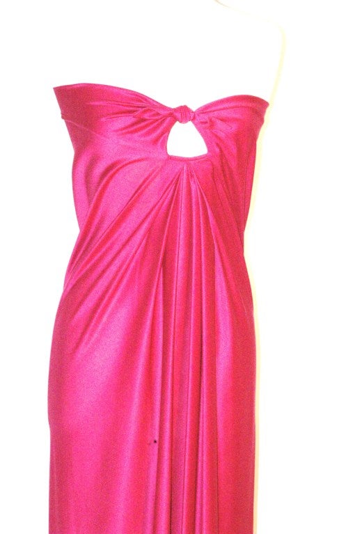 This is a Halston IV Dorian dress for Saks Fifth Avenue
Hotpink strapless with knot and peek-a-boo bust
Size medium
100% polyester
Bust 34-36