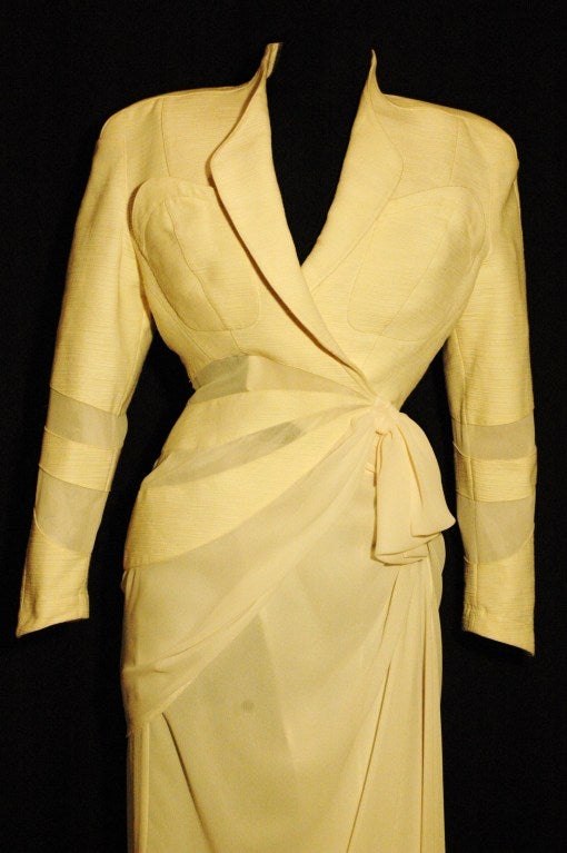 This is a gorgeous rare Thierry Mugler 2 piece evening cocktail skirt suit.  Sheer chiffon wrap style with snap buttons and wrap style jacket.  SIze 40.  2 upper pockets on the jacket.
Jacket measurements:
Bust 34