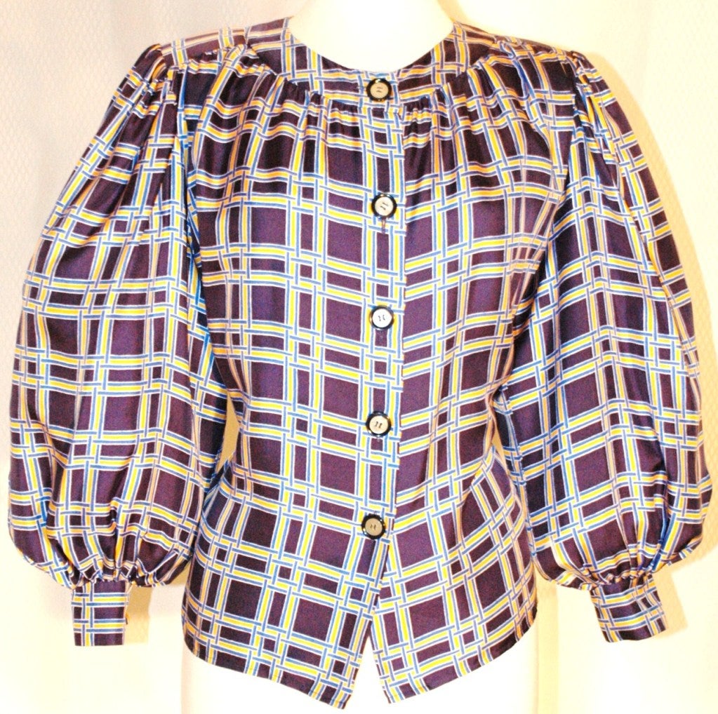 This is a gorgeous Yves Saint Laurent Rive Gauche button up navy, yellow & white plaid pattern print with big puffy sleeves. Size 36
Measurements:
Sleeves 22