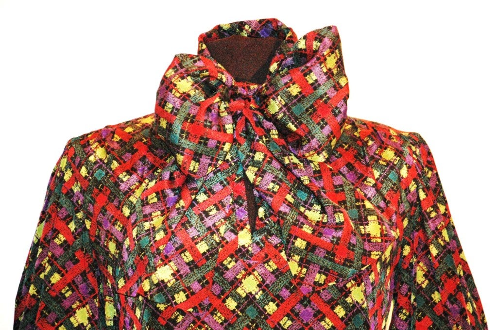 This is an incredible Yves Saint Laurent Rive Gauche multi color plaid print 100% silk blouse with attached scarf. Size 38
Measurements:
Bust 40