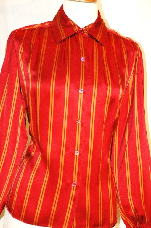 This is a vintage Yves Saint Laurent Rive Gauche silk blouse red with gold stripes size 38.  Made in France.  Button UP
Measurements:
Bust 40