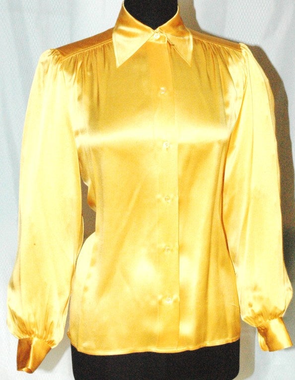 This is a vintage Yves Saint Laurent Rive Gauche 100% silk yellow button up blouse.  Perfect condition. Size 38
Measurements:
Bust 40