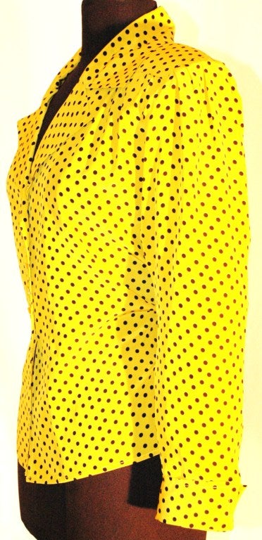 This is a gorgeous vintage Yves Saint Laurent Rive Gauche yellow with black polka dot 100% silk button up blouse Made in France.  Size 38
Measurements:
Bust 40