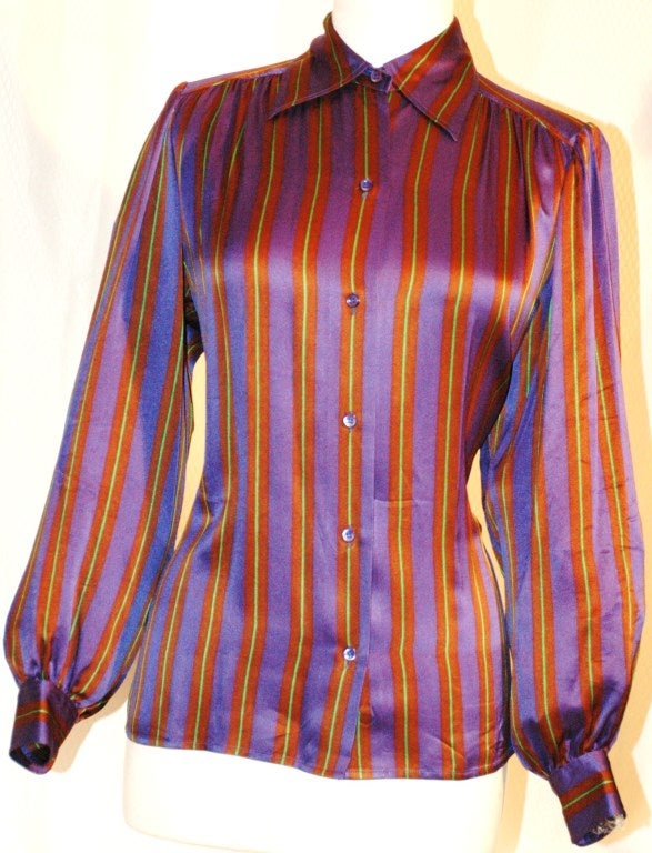 This is a gorgeous vintage Yves Saint Laurent Rive Gauche 100% silk blouse w blue, brown and green stripes button up. Made in France.  Size 38
Measurements:
Bust 40